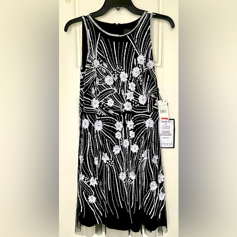 Sequined black and white party dress. Bought for a wedding but never worn.